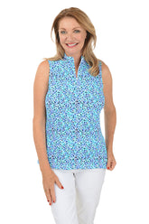 A sleeveless navy and blue floral print top with a mock neckline and zippered half placket. 