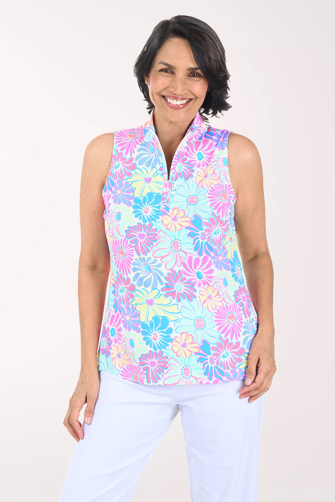 Woman wearing a multicolored sleeveless zip-up top