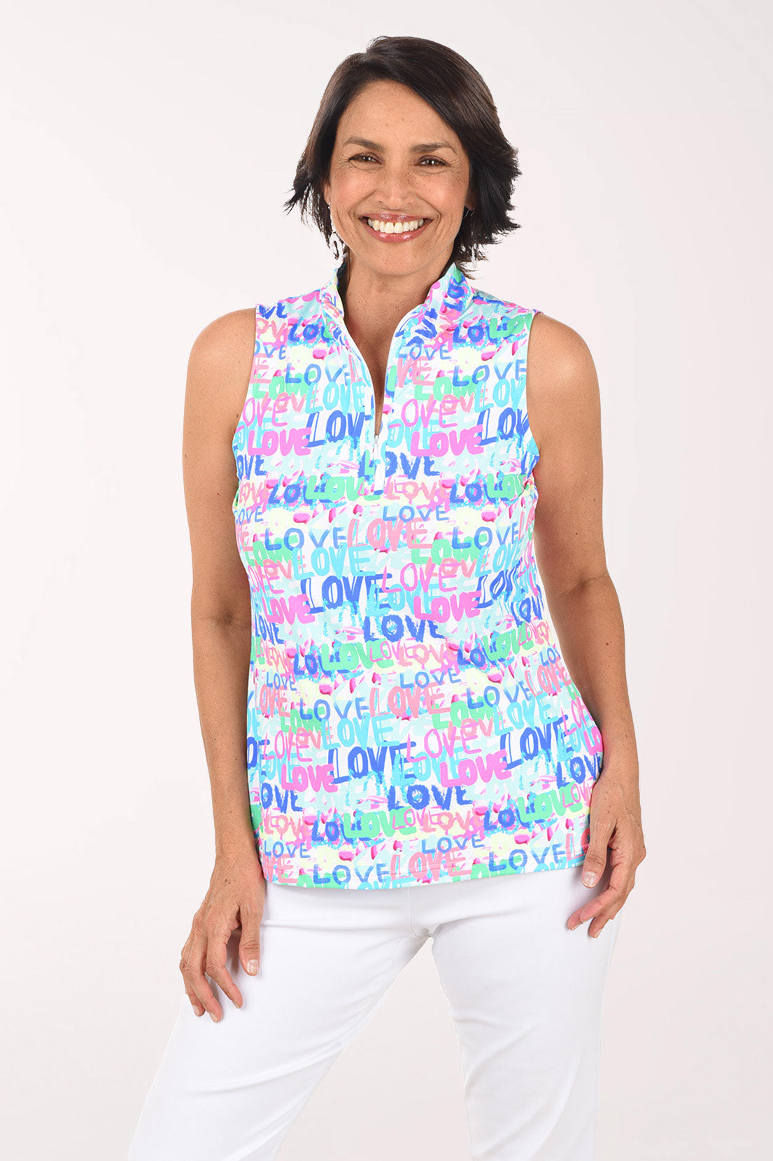 Woman wearing a sleeveless top with 'LOVE' print on a white background