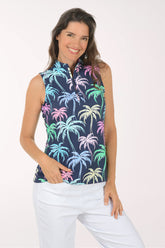 Woman wearing a sleeveless top with colorful palm tree pattern on a white background