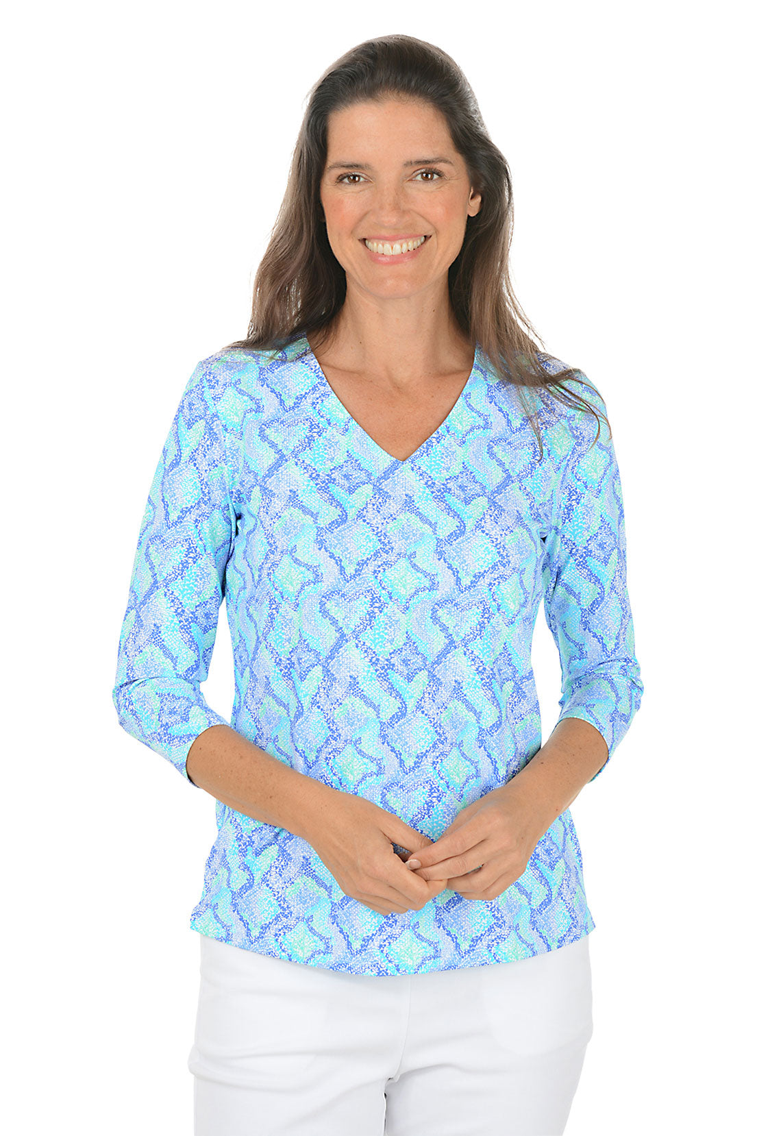 Woman wearing a blue patterned blouse on a white background. Second front shot.