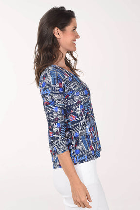 Woman wearing a patterned blouse with a white background