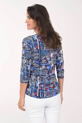 Woman wearing a patterned blouse with a white background
