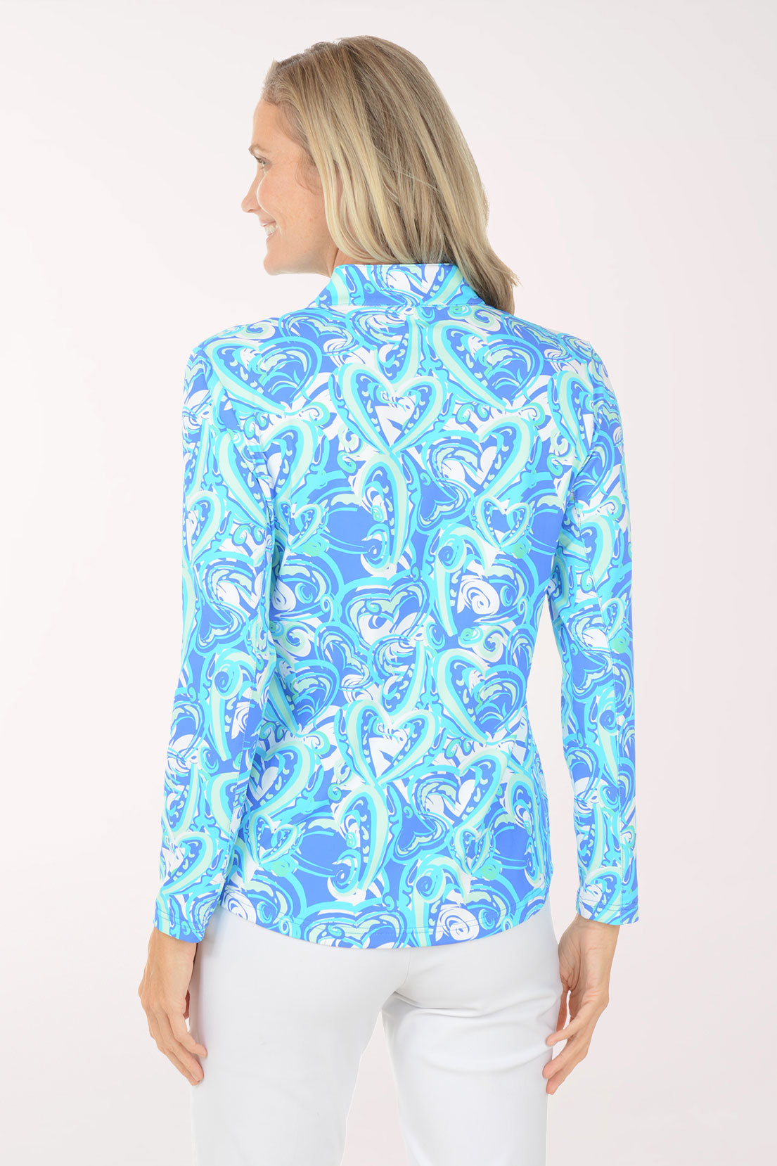 Woman wearing a blue patterned long-sleeve shirt on a white background