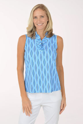 Woman wearing a blue patterned sleeveless top on a white background