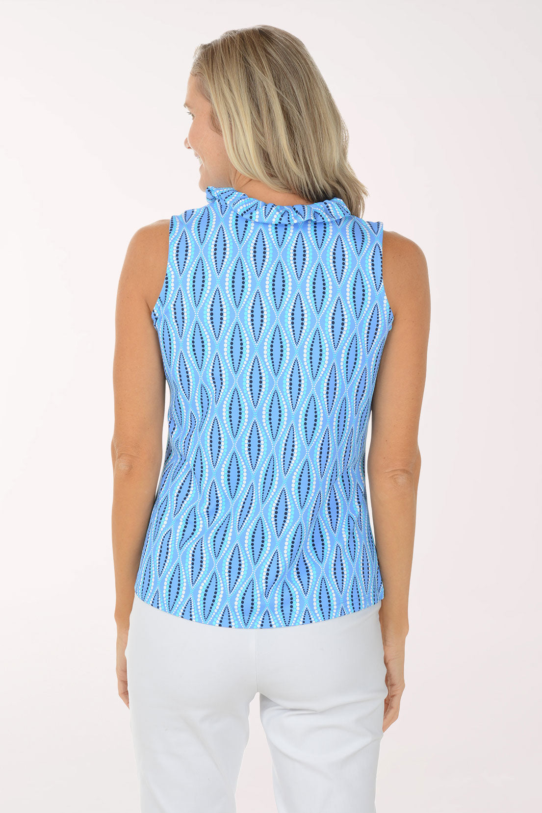 Woman wearing a blue patterned sleeveless top on a white background