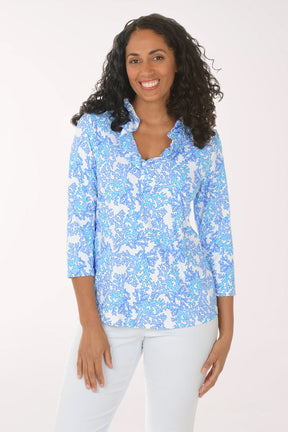 Woman wearing a blue floral blouse with a white background