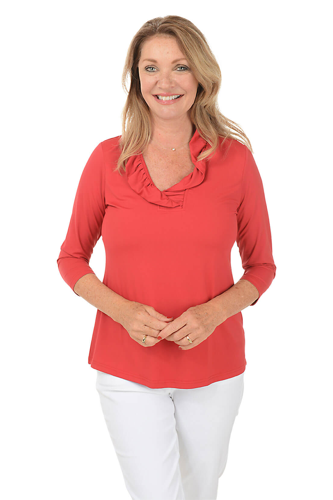 Woman wearing a red blouse with a ruffled collar on a white background