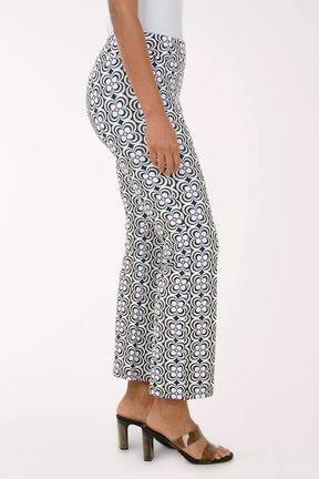 Person wearing a black and white patterned skirt on a white background