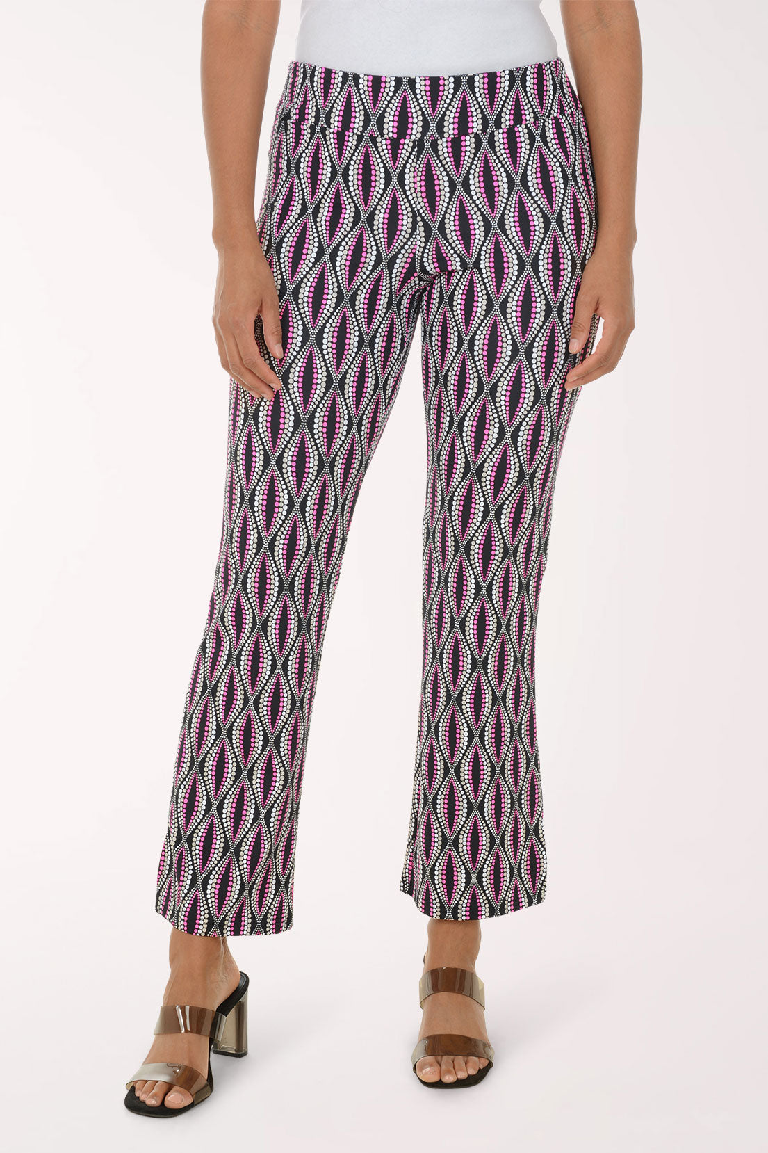 Person wearing patterned pants on a white background