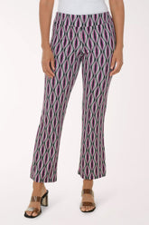 Person wearing patterned pants on a white background
