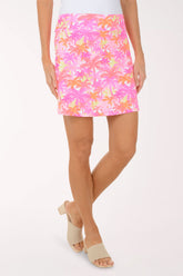 Person wearing a colorful patterned skirt on a white background