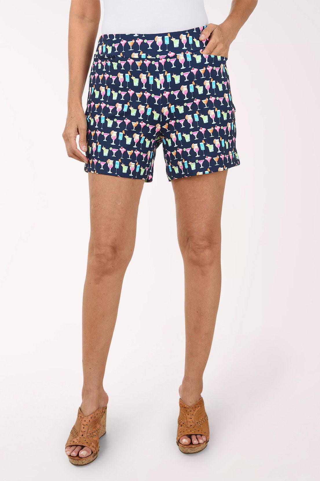 Person wearing colorful patterned shorts on a white background