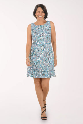 Woman wearing a blue floral dress on a white background