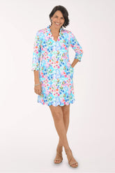 Woman wearing a floral dress on a white background