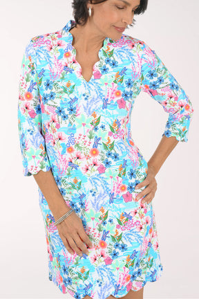 Woman wearing a floral dress on a white background
