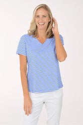 Woman wearing a blue and white striped shirt against a white background