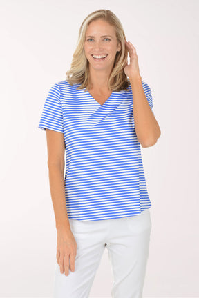 Woman wearing a blue and white striped shirt against a white background