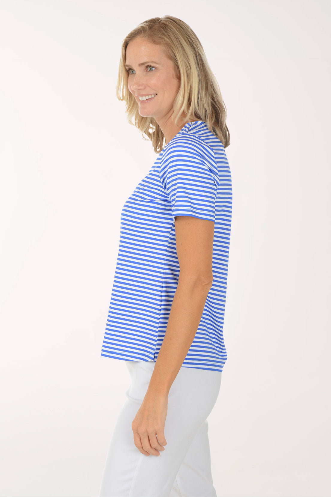 Woman wearing a blue and white striped shirt against a white background