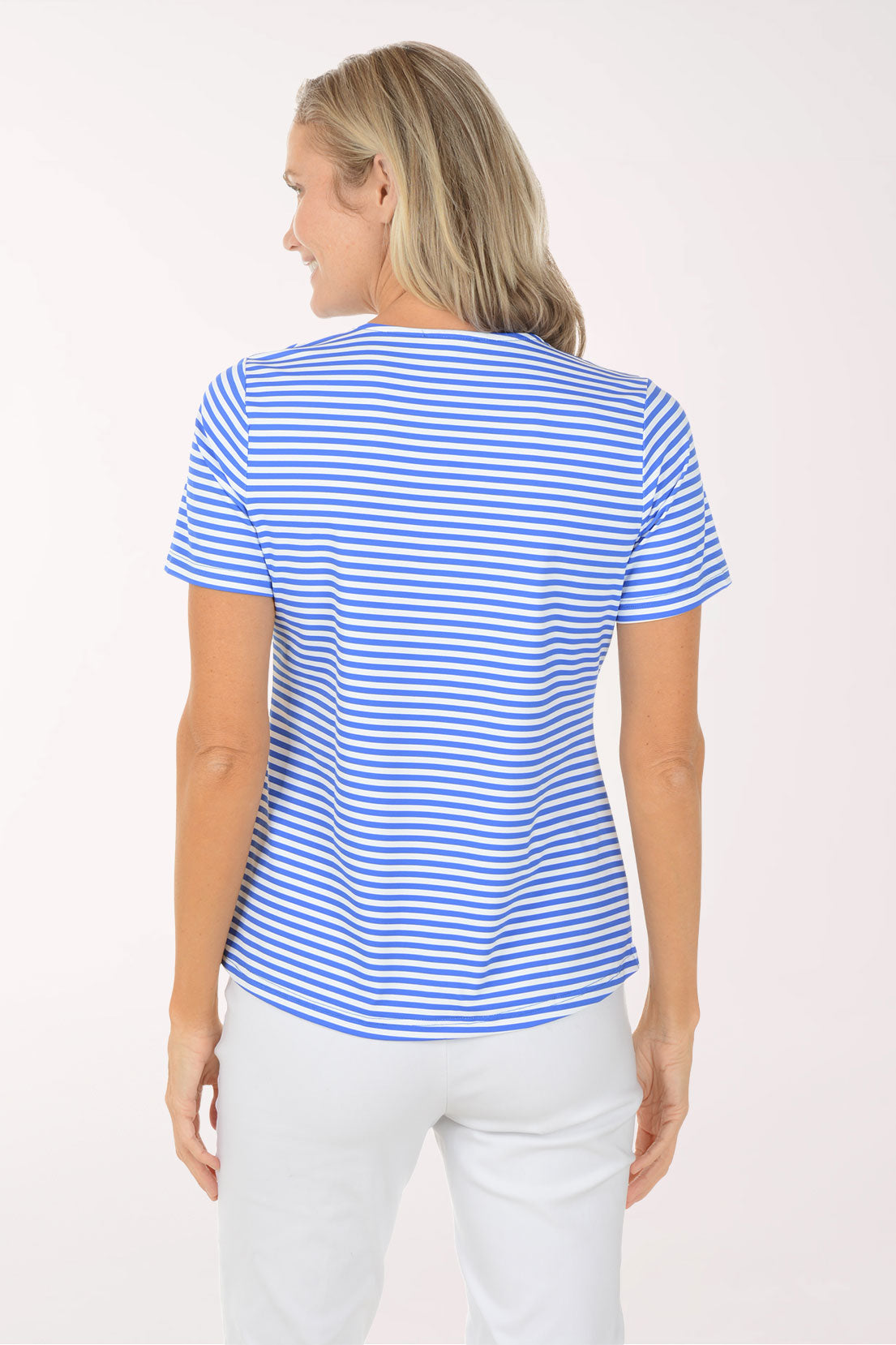 Woman wearing a blue and white striped shirt against a white background