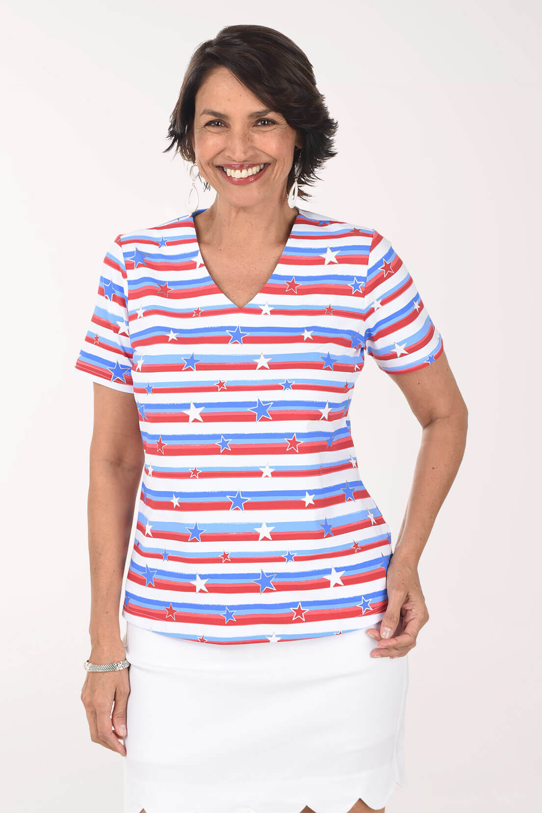 Woman wearing a red, white, and blue striped shirt with star pattern on a white background