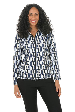 A woman wearing a patterned athletic jacket against a white background