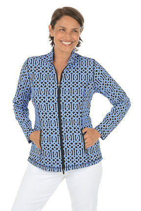 Woman wearing a blue patterned jacket on a white background.