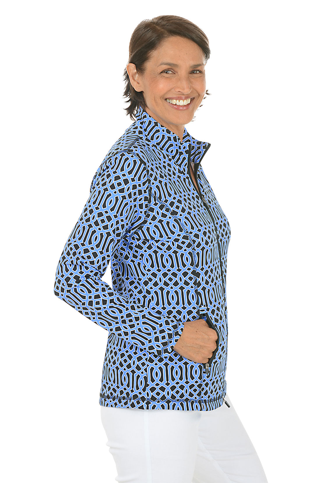 Woman wearing a blue patterned jacket on a white background. Side shot.