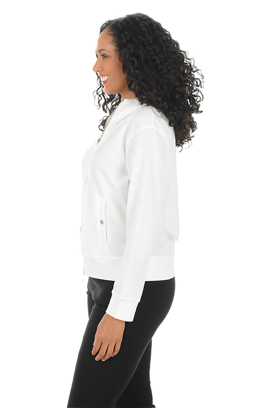 Woman wearing a white jacket on a white background. Side shot.
