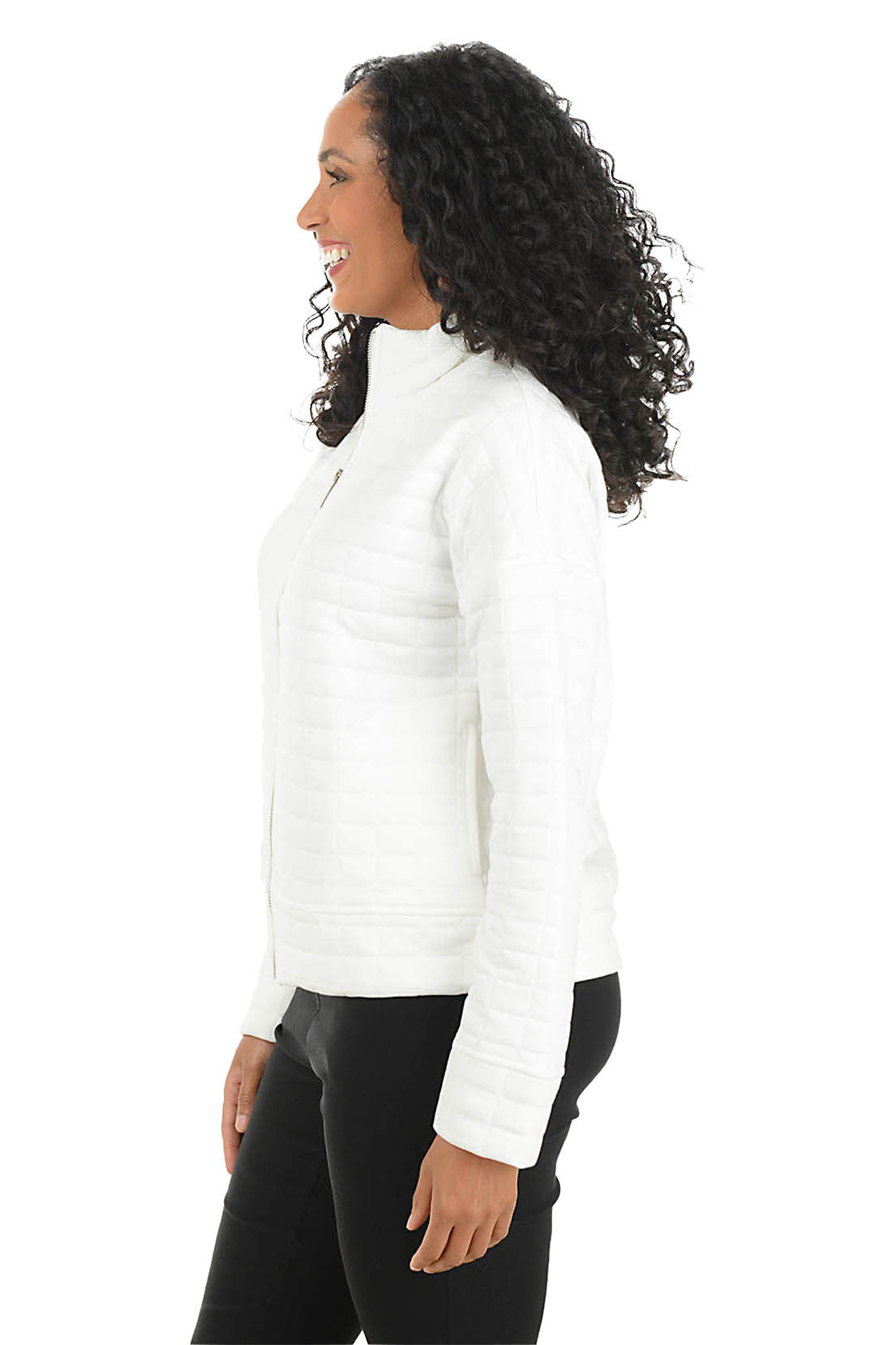 Side view of the white quilted knit zip-front jacket showing the mock neck, cuffed sleeve and banded hem at the hip.