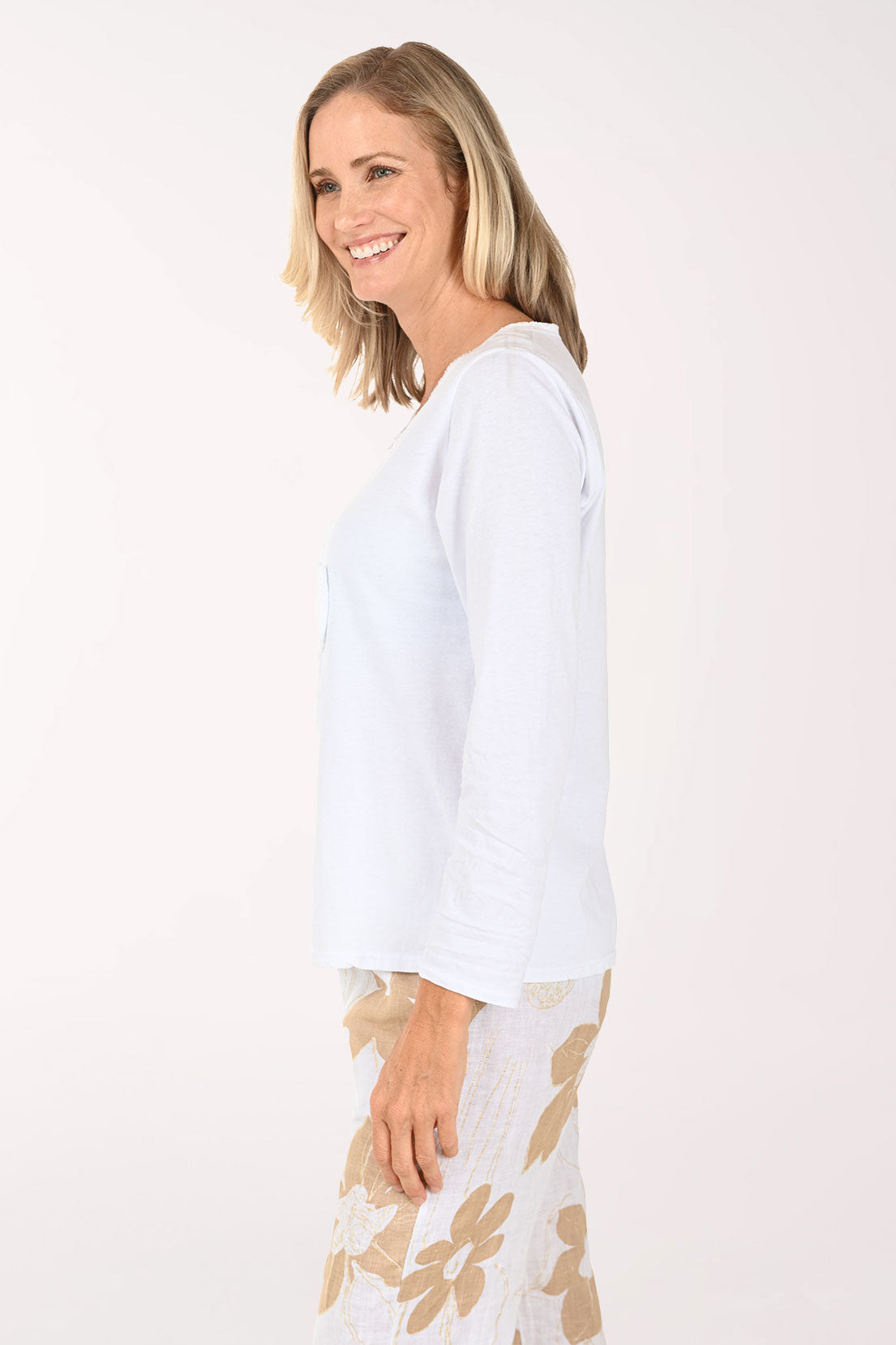 Woman wearing a long sleeve white top