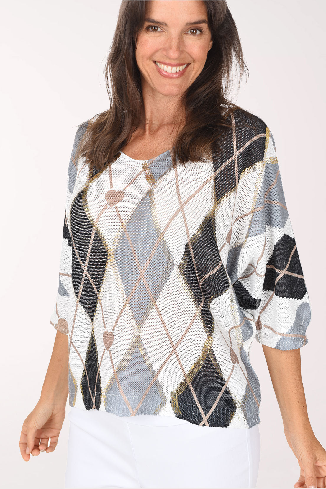 Front view of the grey argyle sweater, showing elbow-length dolman sleeves and a relaxed fit with diamonds outlined in thin gold lines