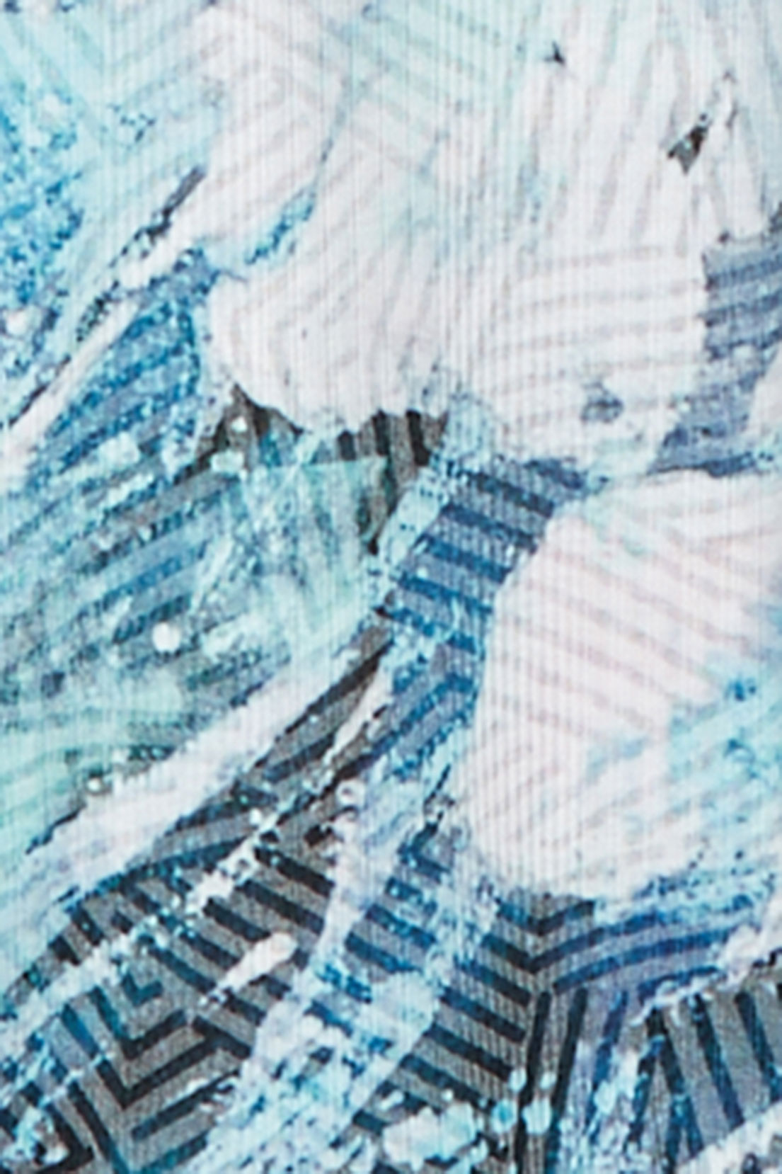 Close-up of the Ann Arbor Ombre fabric showing turquoise, navy and white abstract shapes with fine hatched lines.