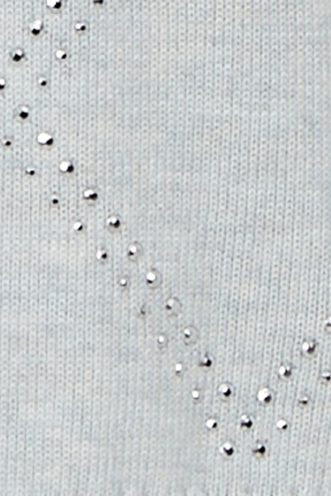 Close-up of the grey cardigan knit showing the silver stud accents along the diamond pattern.
