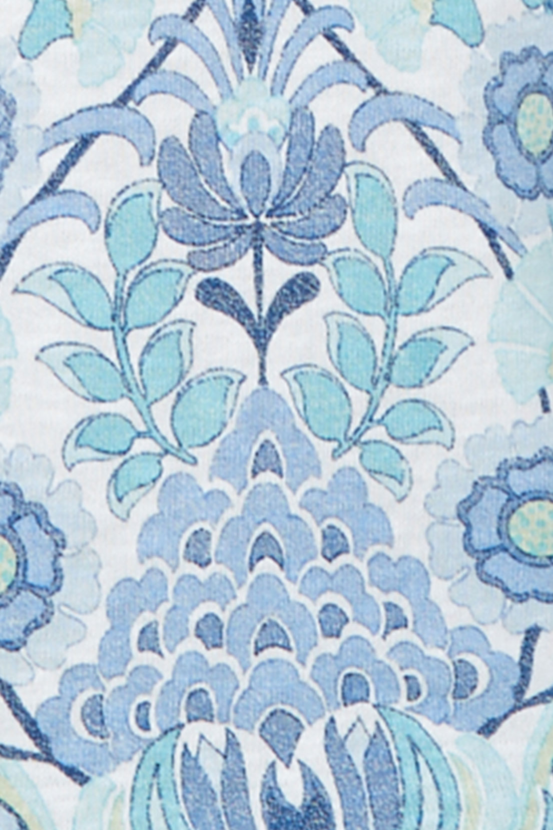 Close-up of the Ann Arbor Damask fabric showing blue and aqua scrolling floral damask on white.