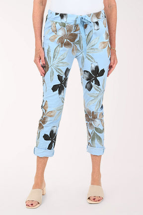 Woman wearing blue floral jogger pants 
