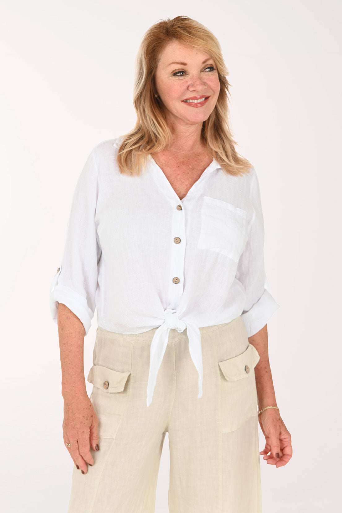 Woman wearing a white button down and beige pants