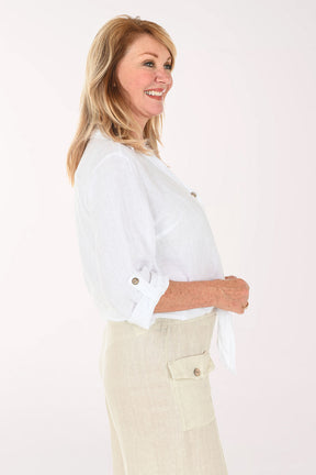 Woman wearing a white button down and beige pants