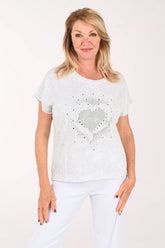 Woman wearing a short sleeve grey tee with the word 'love' on it
