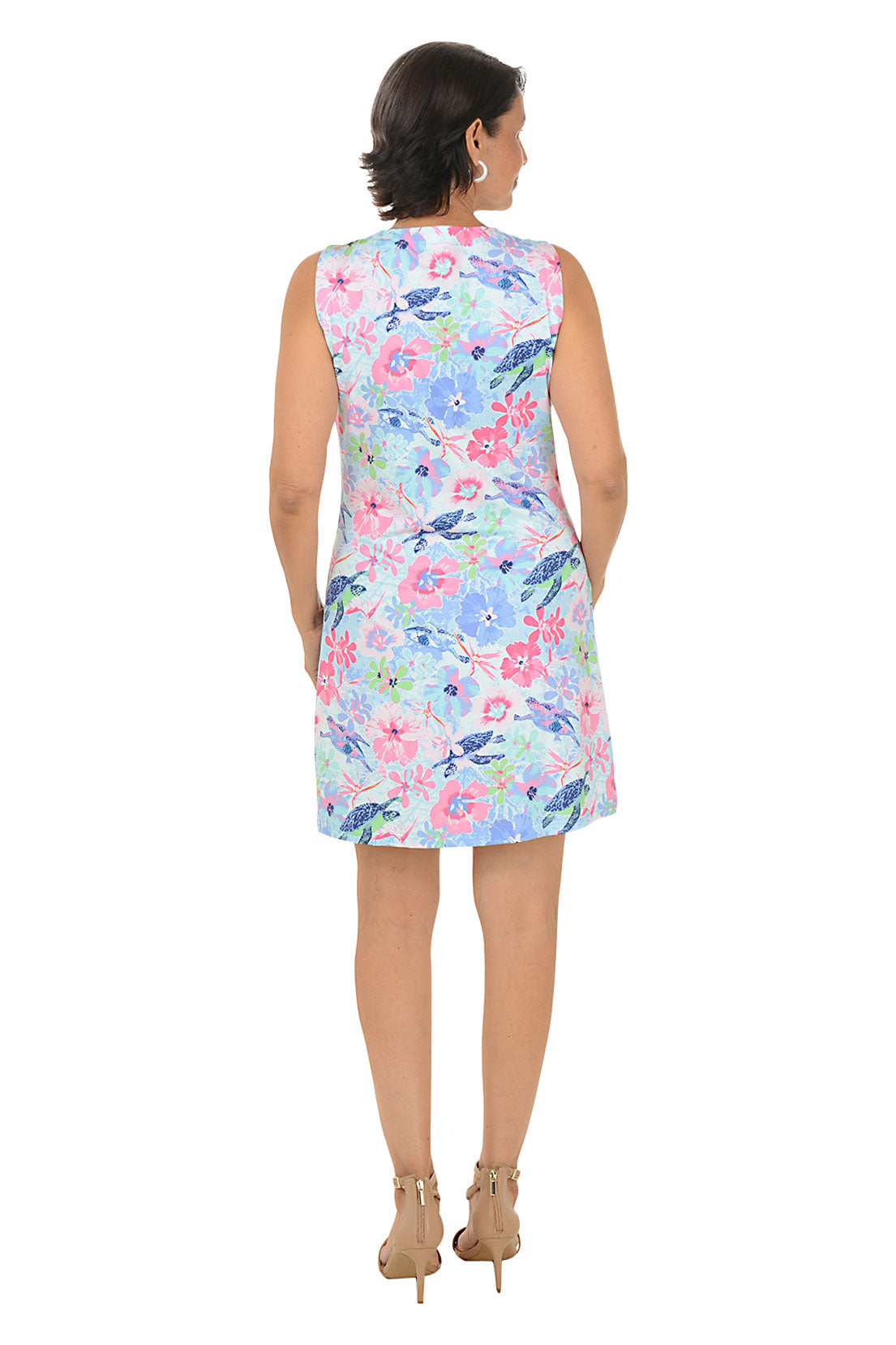 Woman wearing a floral dress with a white background