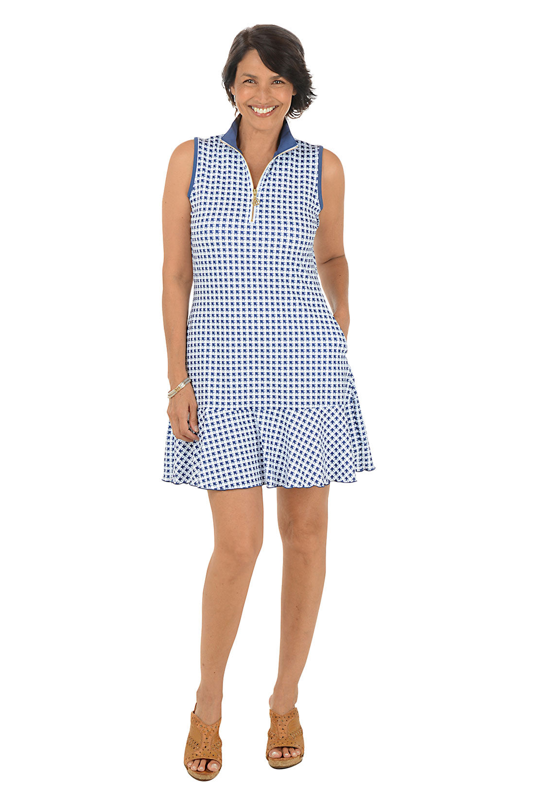 Woman wearing a blue and white checkered dress on a white background
