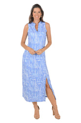 Woman wearing a blue patterned dress on a white background