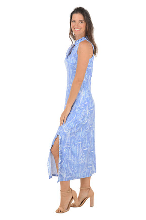 Woman wearing a blue patterned dress on a white background