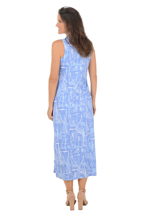 Woman wearing a blue patterned dress on a white background