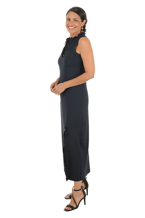 Woman wearing a black sleeveless dress on a white background