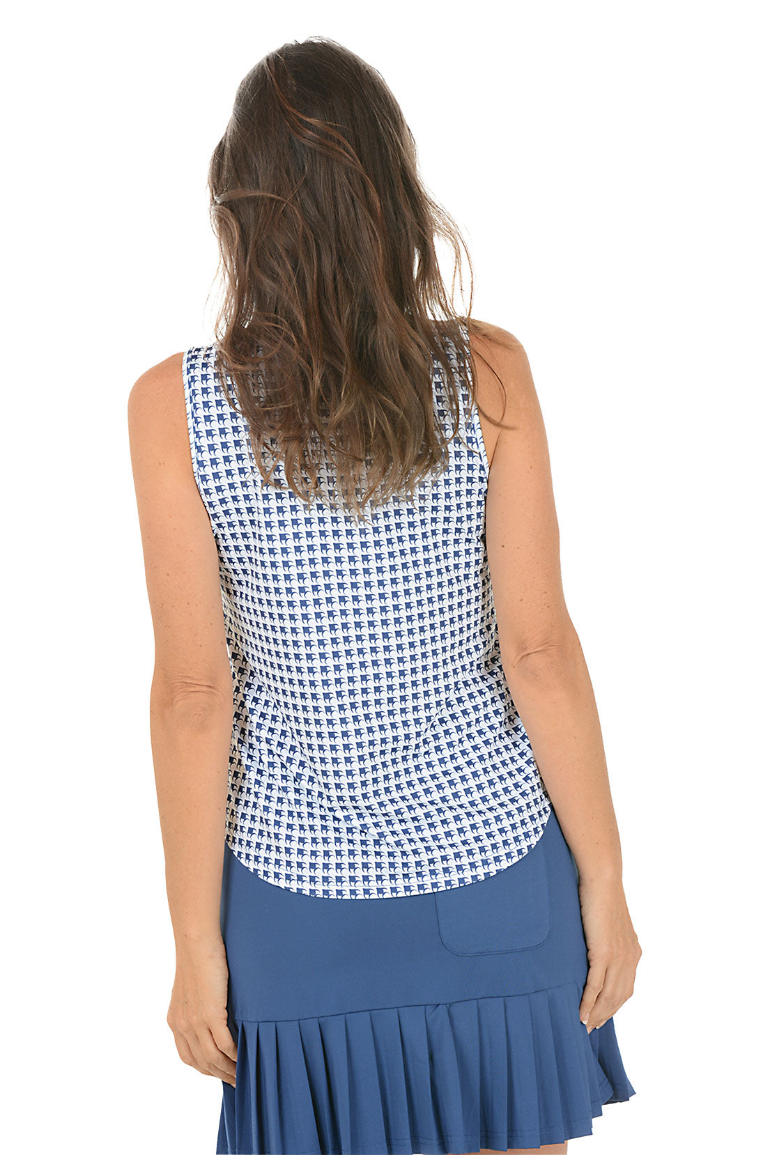 Woman wearing a sleeveless patterned top and blue skirt on a white background