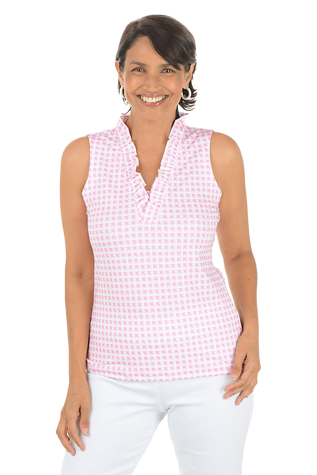 Woman wearing a pink checkered sleeveless top and white pants on a white background