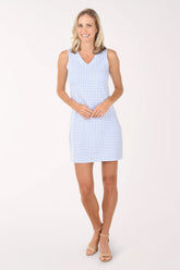 Woman wearing a light blue checkered dress on a white background