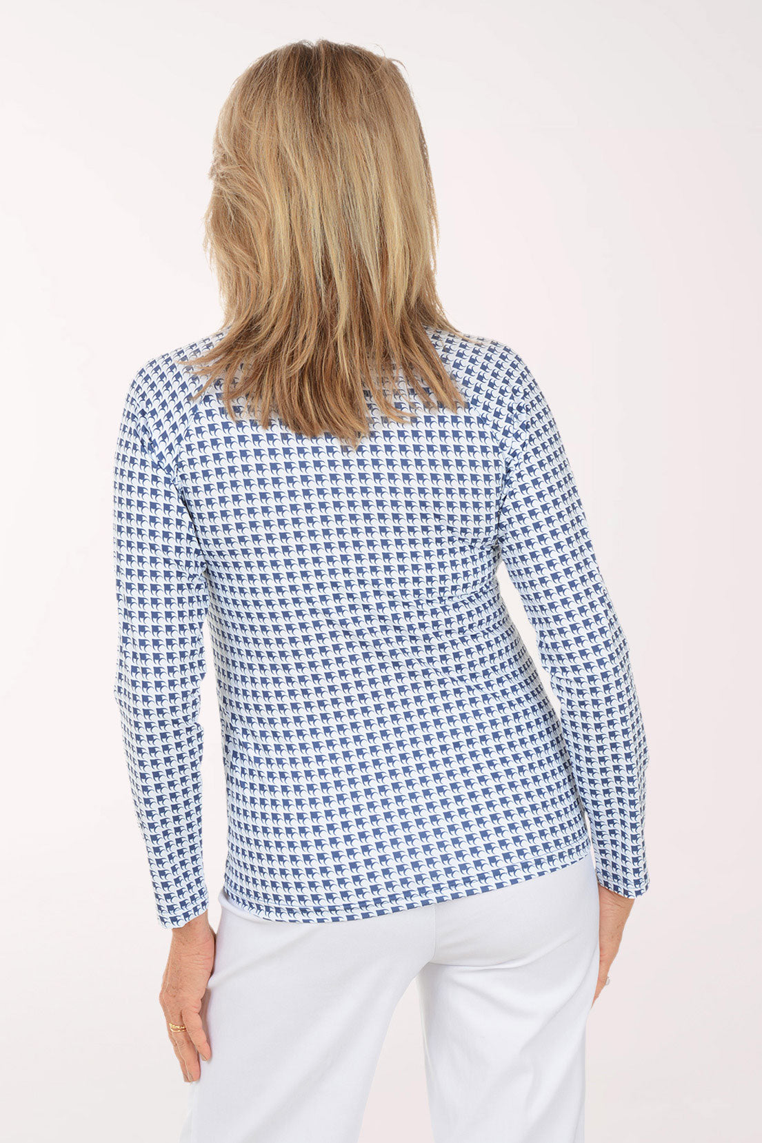 Woman wearing a blue checkered shirt against a white background