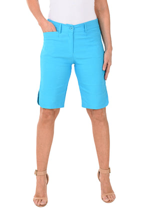 Person wearing bright blue shorts on a white background